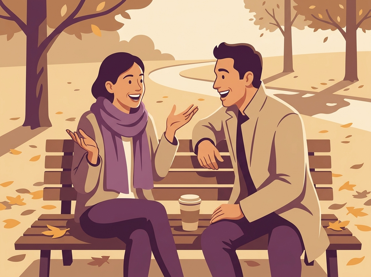 A couple on an autumn park bench, she shares exciting news with animated gestures while he leans in with genuine enthusiasm